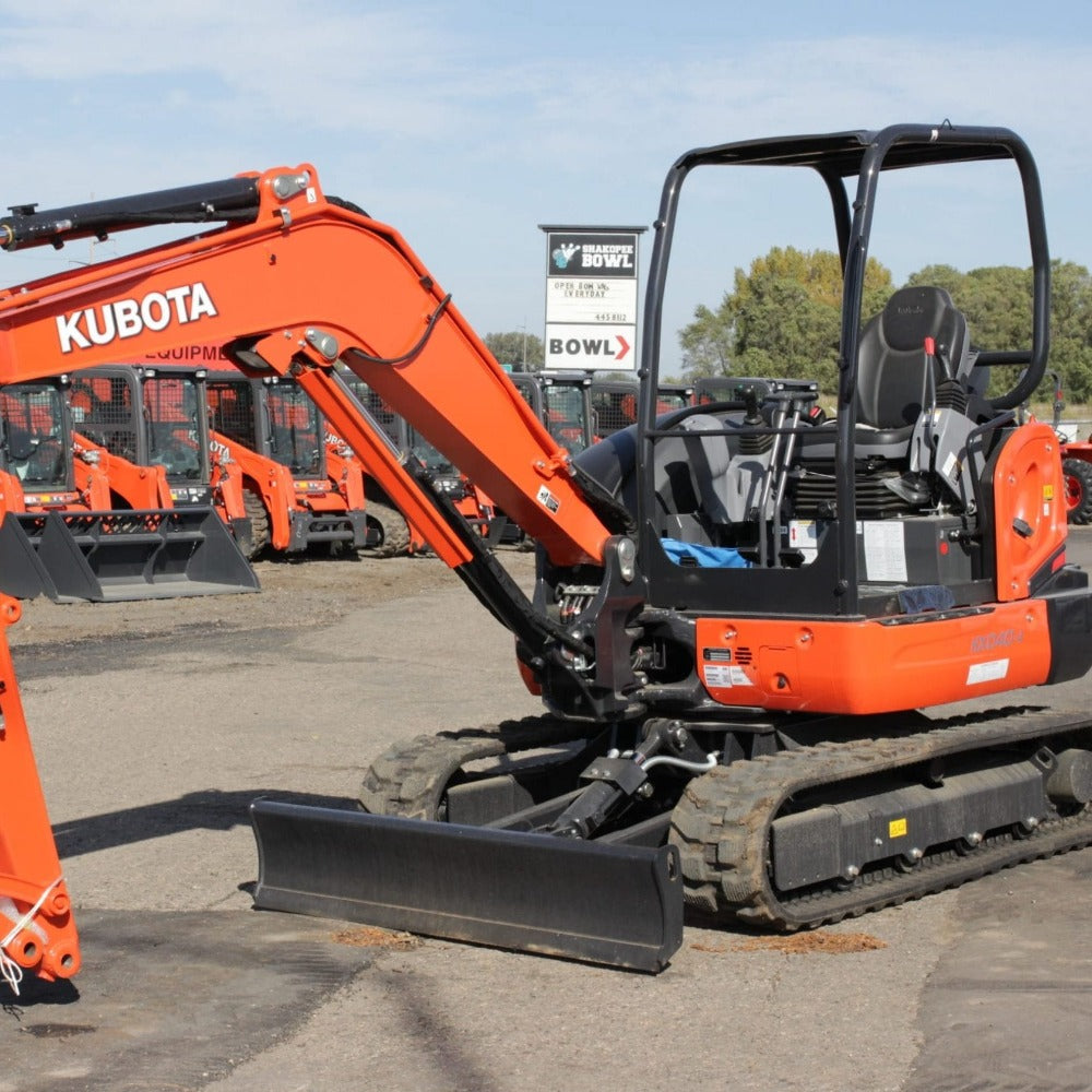 Orange Kubota KX040 in a dealership lot
